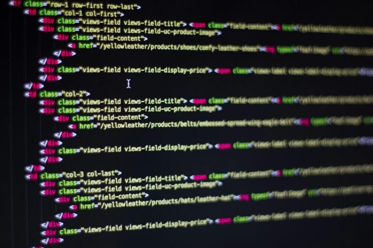 Repertoire Detailed close-up of HTML code on a computer monitor, showcasing web development.